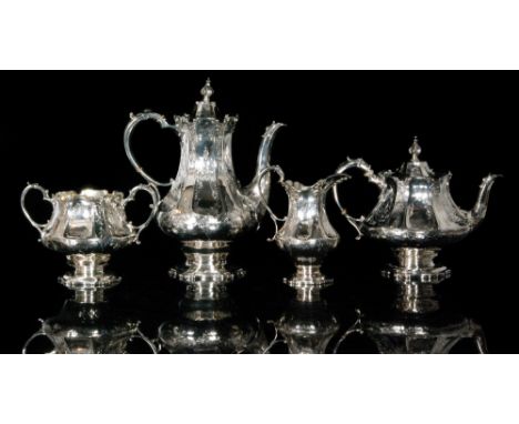 An early Victorian hallmarked silver four piece tea service composing a teapot, a hot water pot, a cream jug and a sugar bowl