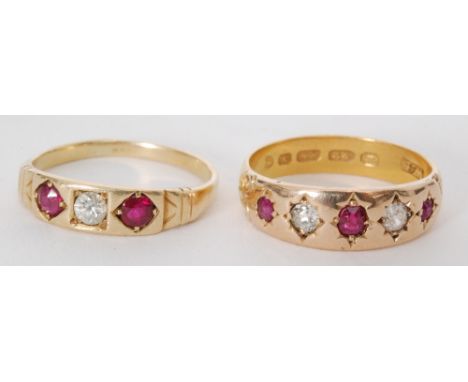 A hallmarked 22ct ruby and diamond gypsy set five stone ring and another similar 18ct ruby and diamond three stone ring, stam