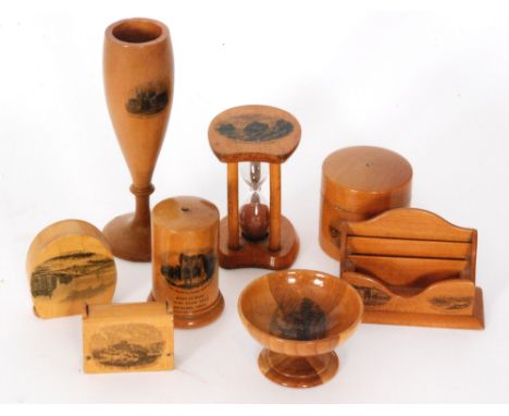 Eight pieces of assorted 19th Century Mauchline Ware comprising an egg timer, a stamp holder formed as a letter rack, two ves