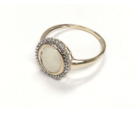 9ct yellow gold white opal and diamond ring, boxed. Ring size S. Postage category A.