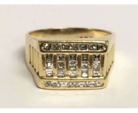 A Mens 18ct gold ring set with a pattern of diamonds, 11g, ring size W/X. Postage category A