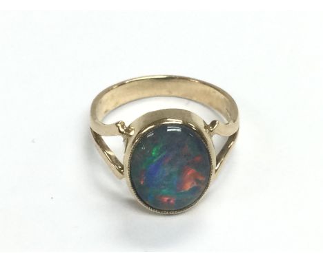 A 9ct gold ring set with an opal, approx 3g and approx size L. Shipping category A.