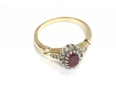A 9ct gold ring set with ruby and diamond. 2.71g and size O