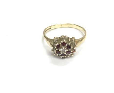A 9ct gold ring set with ruby and diamond stones. Size O and 2.25g