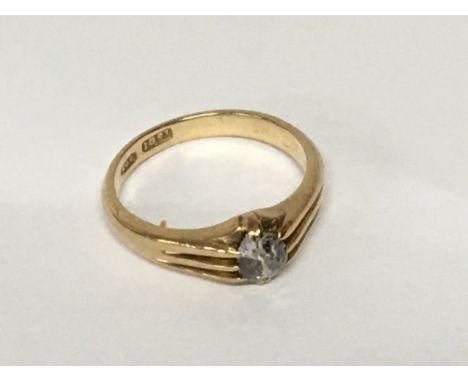 An 18carat gents gold ring set with an old cut oval diamond approximately 0.25 of a carat. Ring size P weight 5g