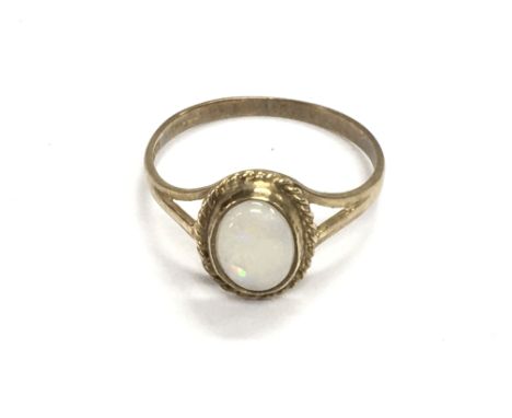 A 9ct gold ring set with Opal. Size N and 1.46g Postage A