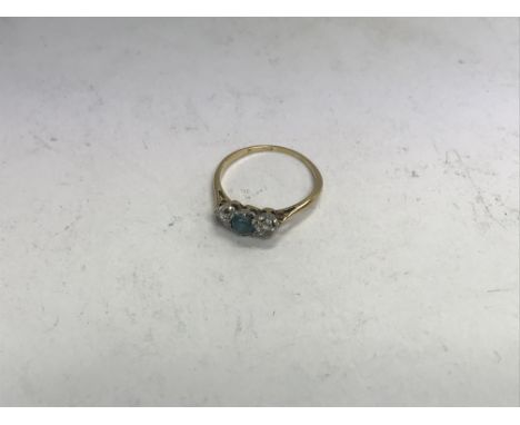 An 18ct diamond and aquamarine set ring. Approx weight 2.09 grams, approx size N.