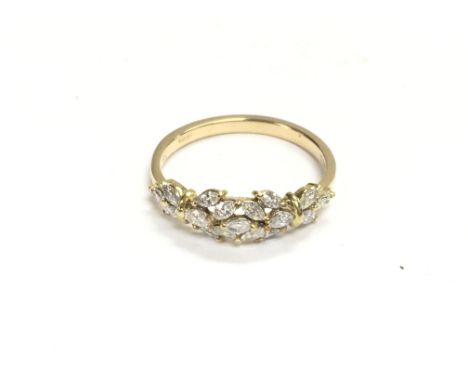 An 18ct gold ring set with diamonds. Size R and 3.14g