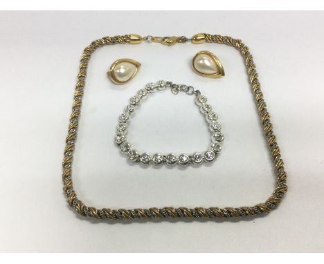 A collection of items including a titanium ring and bracelet (2) A Monet necklace, bracelet and earrings, not a matching set 