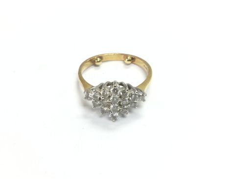 An 18ct gold diamond cluster ring, approx 4.19g and approx size M. Shipping category A.