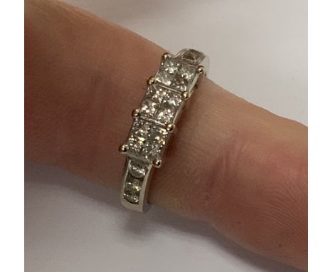 An 18ct white gold illusion set diamond ring, Size L, (A)