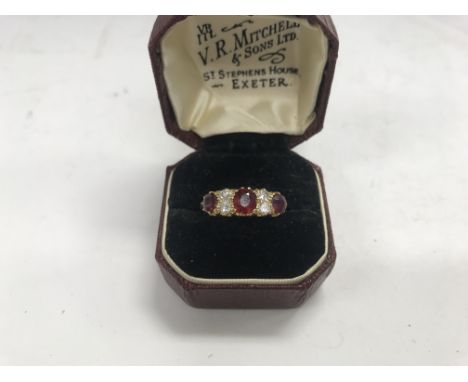 An 18ct Ruby and diamond set ring approx weight 3.03 grams, approx size Q.