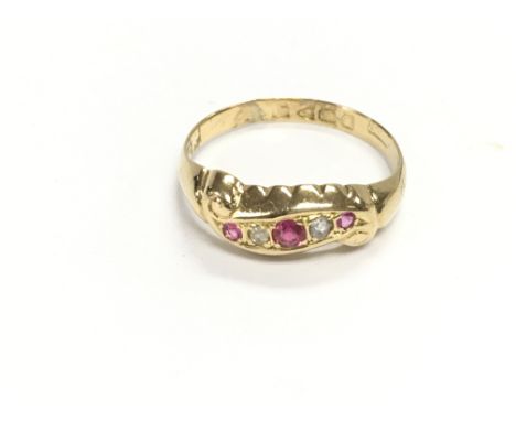 An 18ct gold diamond and Ruby ring. Size Q and 2.33g Postage A