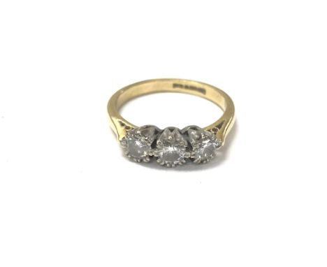 An 18ct gold three diamond ring. Size N 3.7g and approx 0.60ct