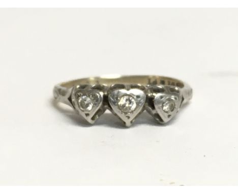 An 18ct gold ring set with chip diamonds. Total weight 2.1g. Ring size I/J. Postage category A