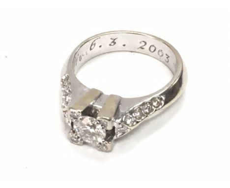 18ct white gold ring central diamond with further diamond. Ring size L/M. Postage Category A.