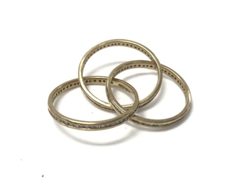 A 9ct gold diamond trilogy puzzle ring. 3.7g size N 1/2