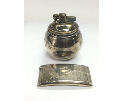 A silver card case and a silver cased table lighter (2). Shipping category B.