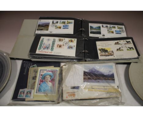 A COLLECTION OF FIRST DAY COVERS AND STAMPS 