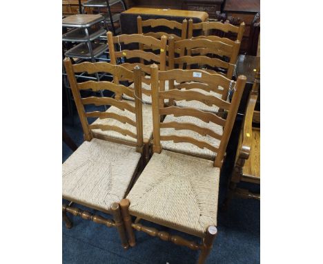 A SET OF SIX OAK LADDER BACKED WICKER SEAT DINING CHAIRS