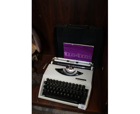 A CASED ADLER TIPPA TYPEWRITER 