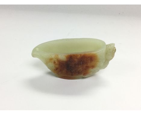 A small jade vessel with incised decoration, approx width 7.5cm. Shipping category A.