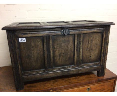 A small 18th Century style English oak panel trunk with a hinge top good condition. 65x40cm