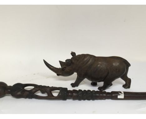 A carved hardwood possible lignam vitae and carved hardwood tribal stick (2)