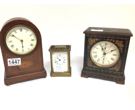 An Edwardian mantel clock a brass carriage clock and a black lacquer clock and one other. (4)