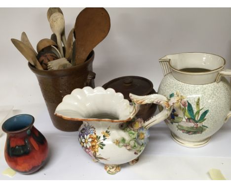 A Victorian stoneware jar containing a collection of antique wooden treen vernacular spoons a conforming stoneware cooking po