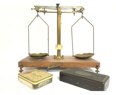 Brass and wood beam balance scales with weights. Postage category C. NO RESERVE