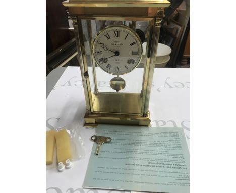 A Sewills brass pendulum mantle clock. Winds and runs. 17cm wide and 28cm high. Postage D