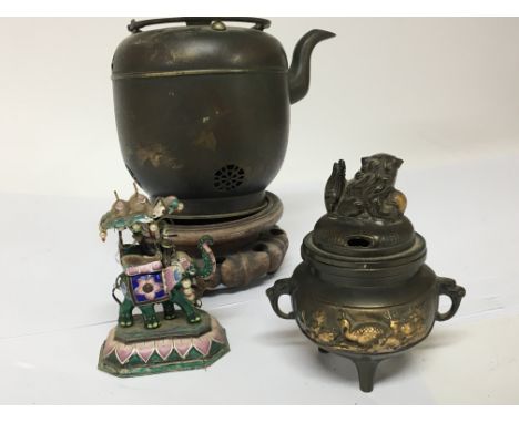 A 20th century oriental bronze koro an Indian enamel ornament in the form of an elephant and a Japanese metal tea vessel with