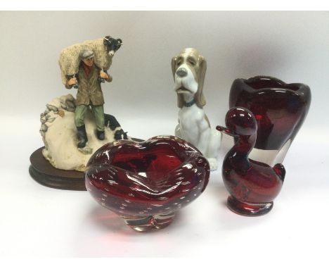 A Border Fine Arts figural group from The James Herriot collection by Anne Butler, a Nao figure of a dog and three ruby glass