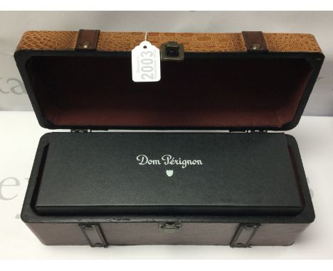 A vintage 1999 Dom Perignon 750ml sealed bottle of champagne, sealed box, with outer simulated leather bottle case. (D)