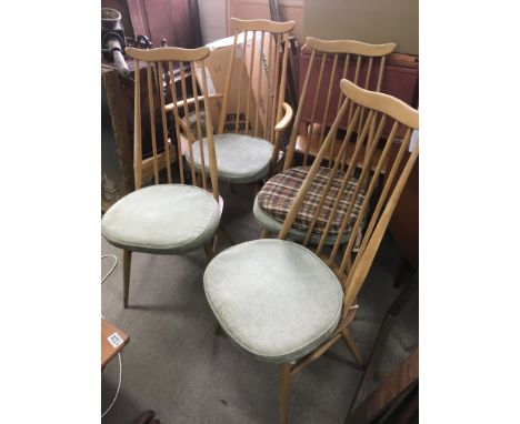 A set of four Mid 20th century Ercol blonde and light wood dining table chairs. Dimensions 95x42cm