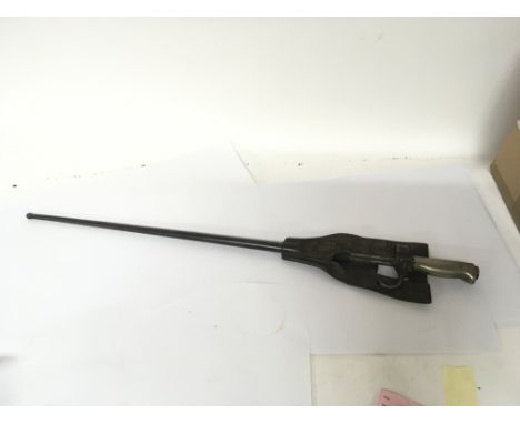 A French 1886 pattern stick bayonet the quillion with serial number with original leather belt hanging.