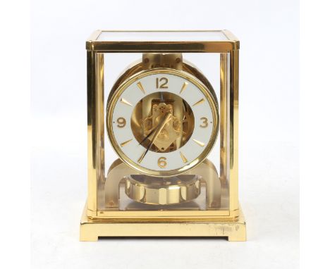 A circa 1960's Jaeger LeCoultre gilt brass Atmos Clock, serial number 192597, the glazed case with canted angles and a circul