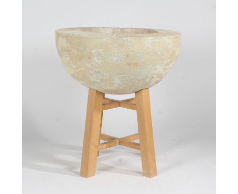 A large cast ceramic contemporary sculpture on a wooden stand, 60cm high 55cm diameter.