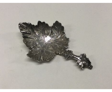 A silver caddy spoon with leaf decoration. Birmingham 1831. By Joseph Wilmore. Approx. 20 grams. Est. £80 - £120.