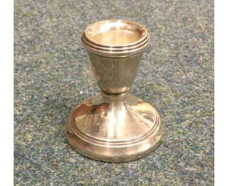 A small silver candlestick. London. Approx. 44 grams. Est. £10 - £20.