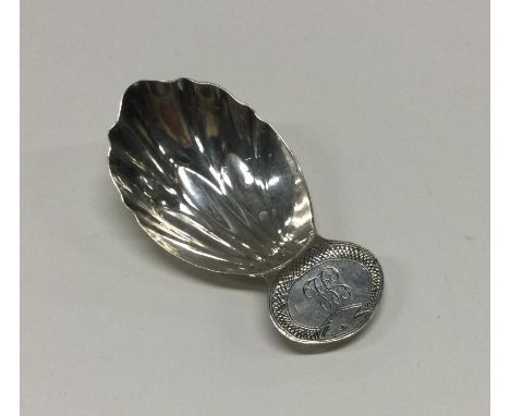 A George III silver caddy spoon with fluted bowl to snake decorated handle. London 1812. By Solomon Houghman. Approx. 9 grams