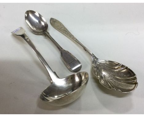 A Georgian silver fiddle pattern ladle together with a preserve spoons. etc. Approx. 126 grams. Est. £25 - £30.