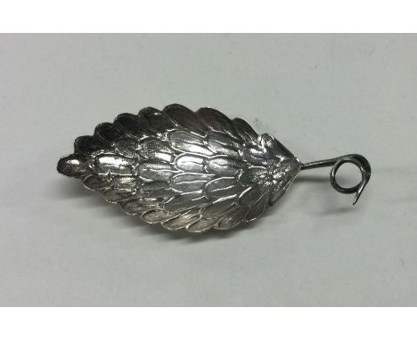 A 19th Century silver caddy spoon with feathered wing decoration. Birmingham. By Samuel Pemberton. Approx. 6 grams. Est. £80 