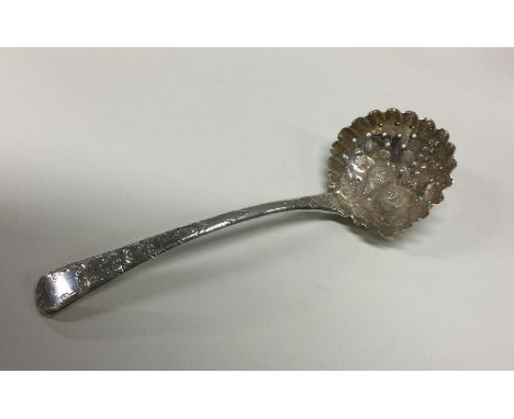 A fine quality George III silver sifter ladle chased with fruit. London 1808. By Thomas Wilkes Barker. Approx. 48 grams. Est.