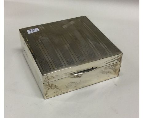 An engine turned silver cigarette box. Chester. By TS. Approx. 206 grams. Est. £20 - £30.