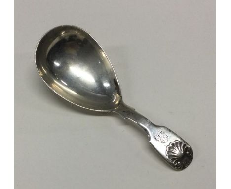 A George III silver caddy spoon with shell back. London 1832. By William Bennett. Approx. 15 grams. Est. £5 - £10.