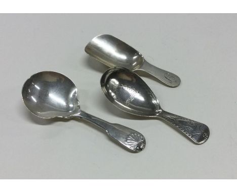 Three Georgian silver caddy spoons. Various dates and makers. Approx. 37 grams. Est. £50 - £80.