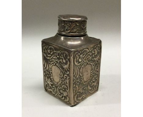 A chased silver tea caddy. By Goldsmiths &amp; Silversmiths. Approx. 121 grams. Est. £70 - £80.