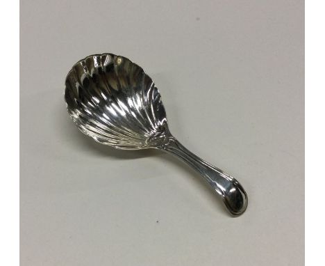 A George III silver caddy spoon with fluted bowl. London 1834. Approx. 8 grams. Est. £50 - £80.